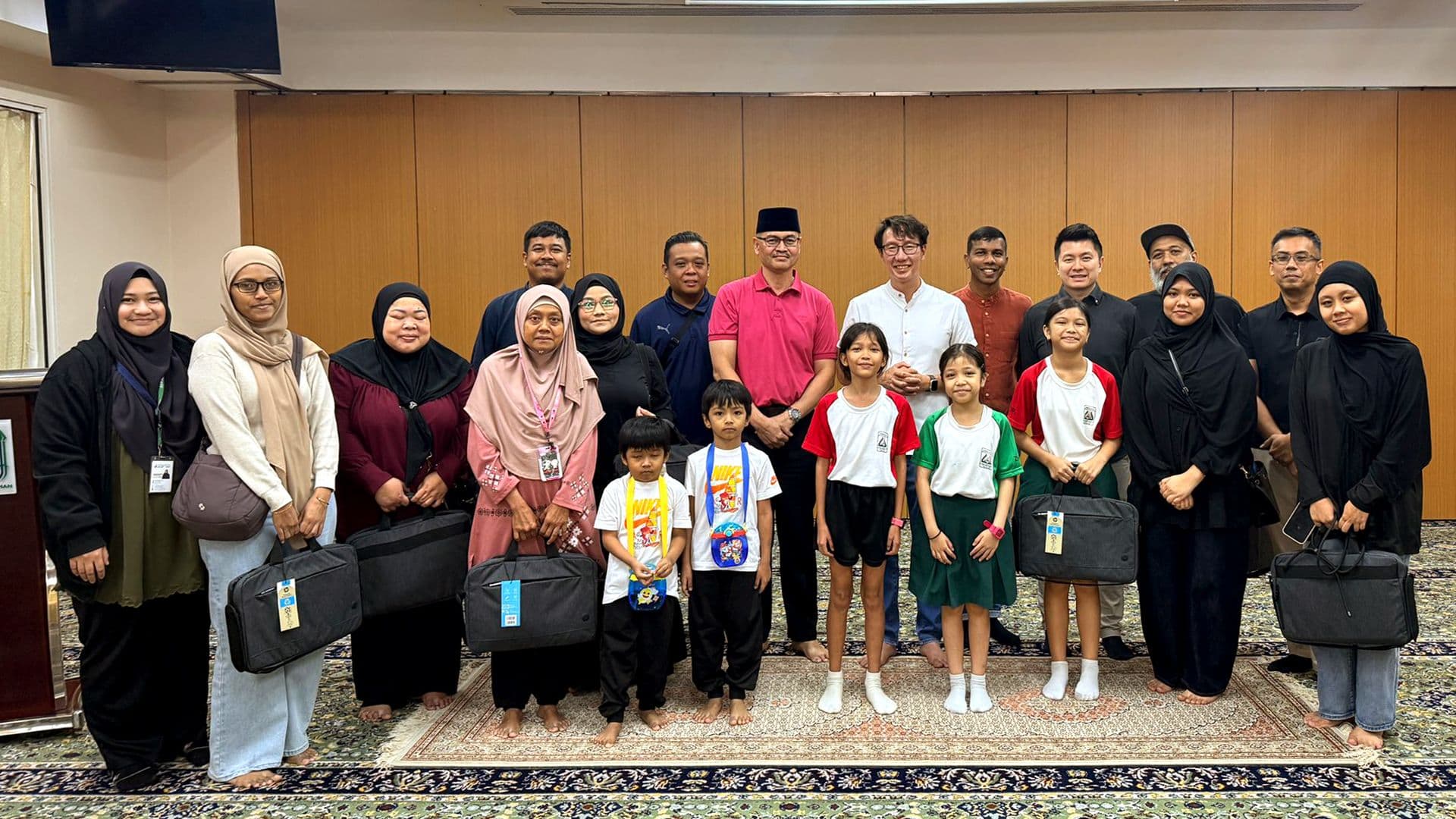 Empowering Our Local Communities Through Technology: KGS Donates 10 Laptops to Families in Need at Masjid Al-Iman