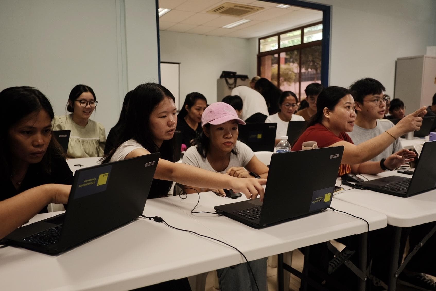 From Recycled to Renewed: How 12 Laptops Opened Up Digital Learning for Foreign Workers in Singapore